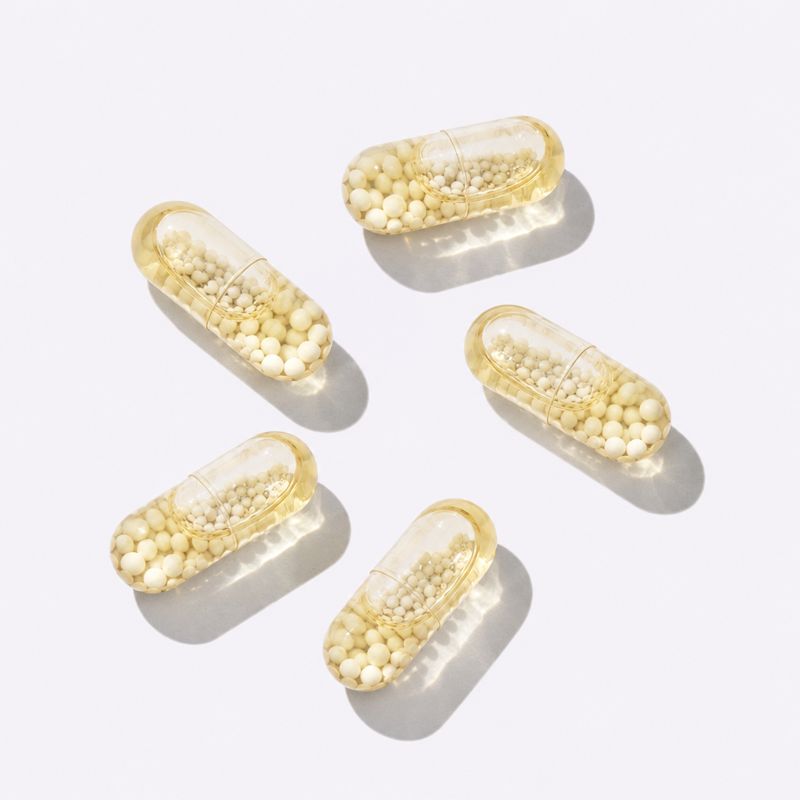 Capsules laid out on a white surface